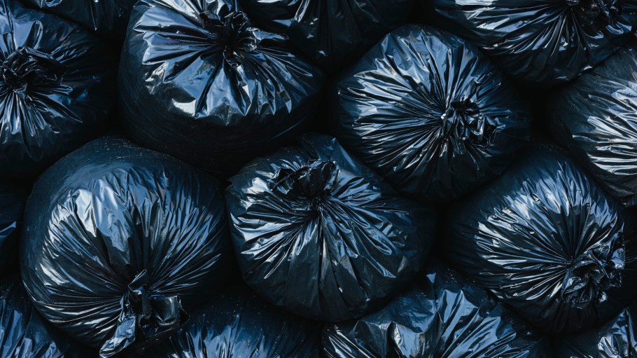 Pile of black plastic garbage bags.
