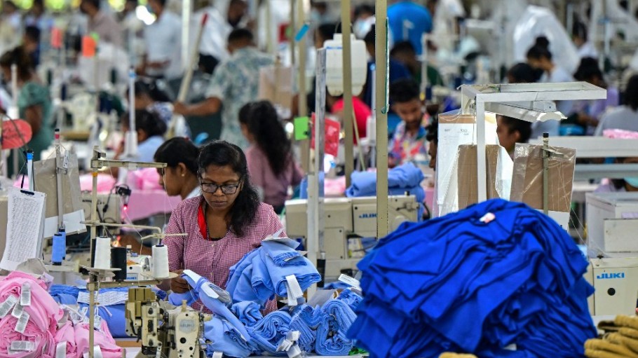 Employees sew garments inside a garment factory in Katunayake free trade zone in Sri Lanka.