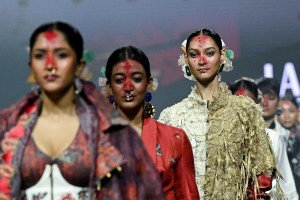 Models present creations by designers Kanika and Nilanjan at the Lakme Fashion Week in Mumbai on March 21, 2026. (