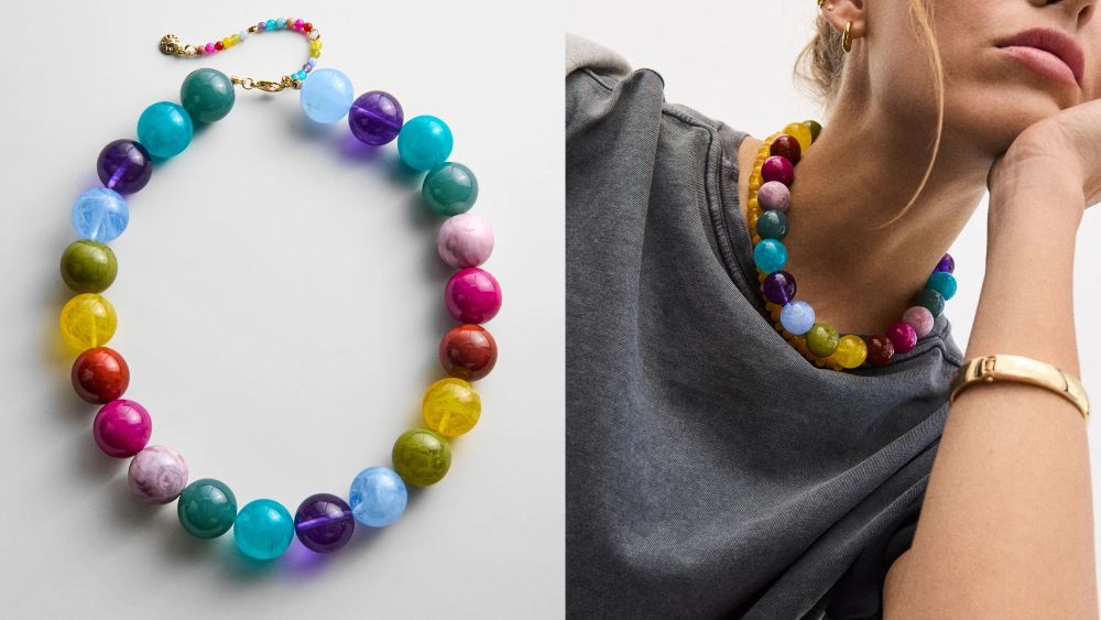 close-up shot of baublebar's multicolored jane necklace; female model wearing baublebar jane necklace with gray t-shirt; how to shop viral baublebar beaded necklace