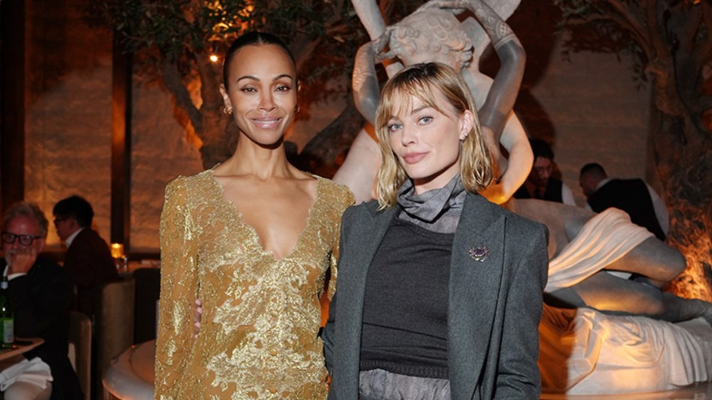 Zoe Saldaña in Saint Laurent and Margot Robbie in Giorgio Armani attend the unveiling of "RH Milan, The Gallery on Corso Venezia" event on April 21 in Milan.