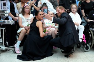 MELBOURNE, AUSTRALIA - APRIL 14: Meghan, Duchess of Sussex and Prince Harry, Duke of Sussex pose for a selfie with children and their families during a visit to the Royal Children’s Hospital on April 14, 2026 in Melbourne, Australia. The Duke and Duchess of Sussex are on a four-day visit to Australia, with engagements across Melbourne, Canberra and Sydney. (Photo by Asanka Ratnayake/Getty Images)