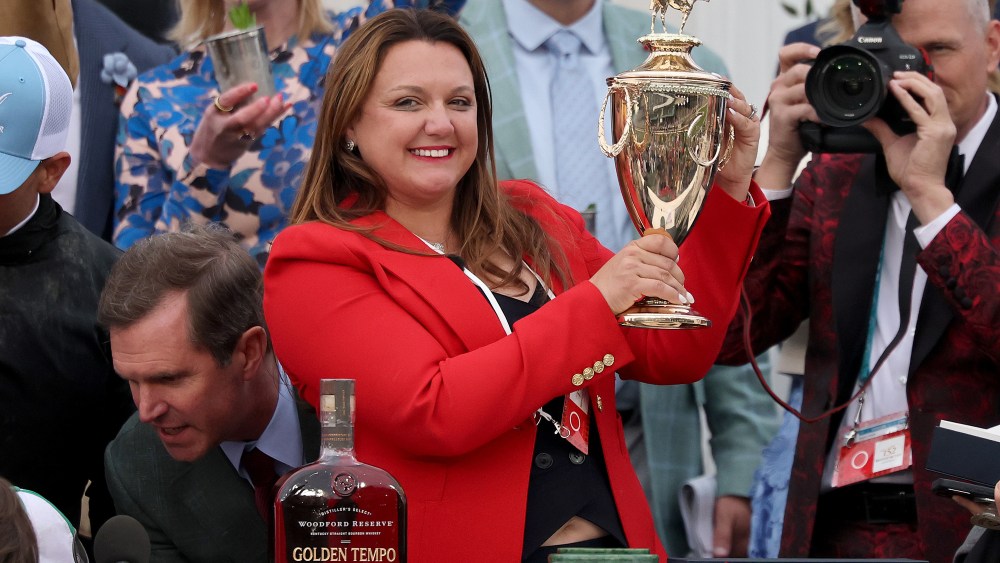 Cherie DeVaux trainer of Golden Tempo #19, is the first female trainer to win the Kentucky Derby, celebrates with the trophy in the winner's circle following the 152nd running of the Kentucky Derby at Churchill Downs on May 02, 2026 in Louisville, Kentucky.