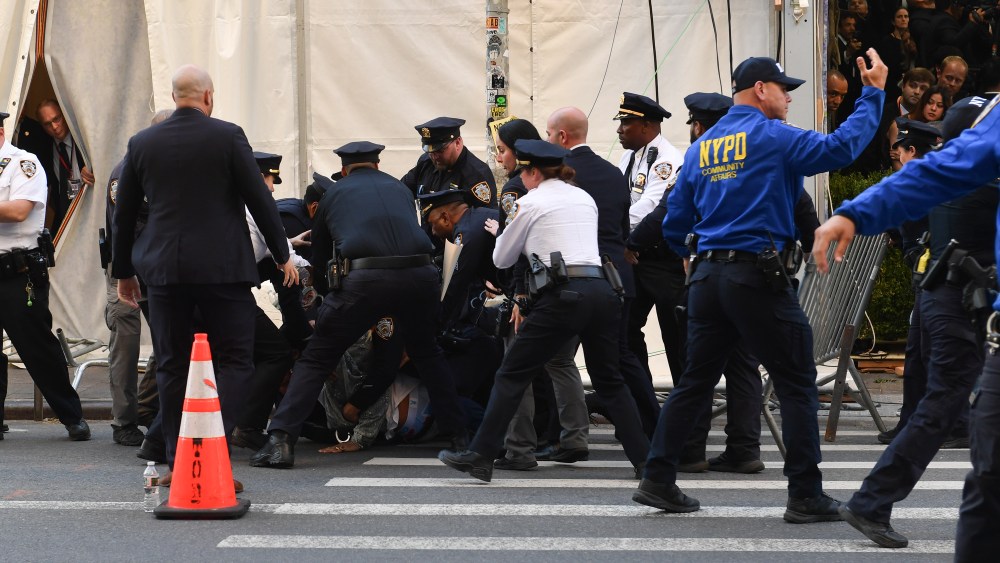 A protester is detained by the NYPD after trying to break into the 2026 Met Gala celebrating "Costume Art" at Metropolitan Museum of Art on May 04, 2026 in New York City.