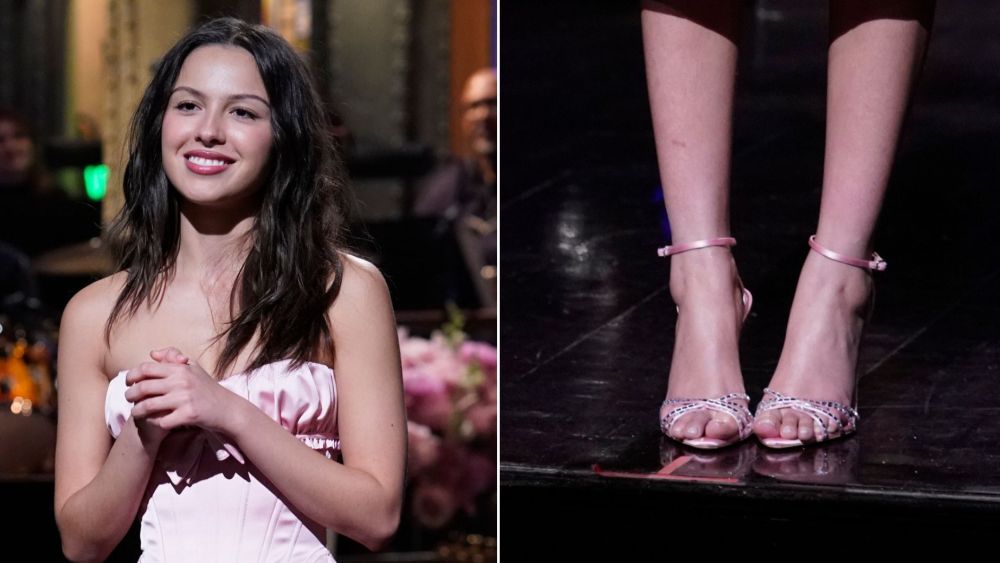 Olivia Rodrigo wearing Aquazzura's crystal-embellished Tell Me Sandals during her opening monologue on "SNL" on Saturday, May 2.